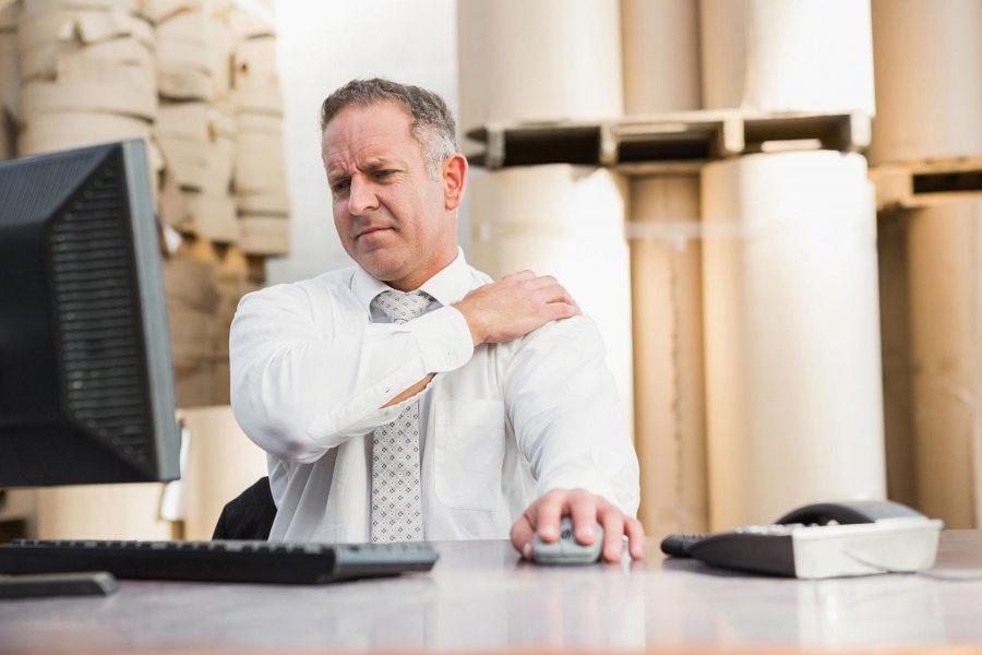 Man at work with shoulder pain.
